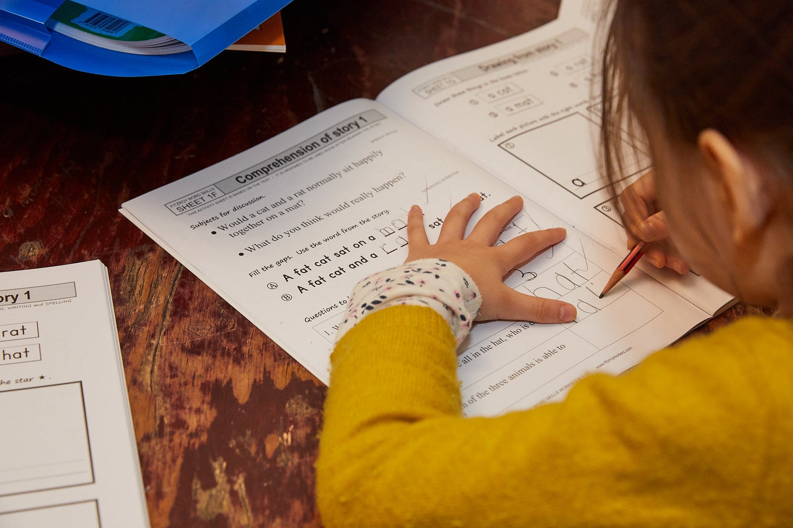 Why Pencils, Paper and Books Are So Powerful for Learning to Read and Write!